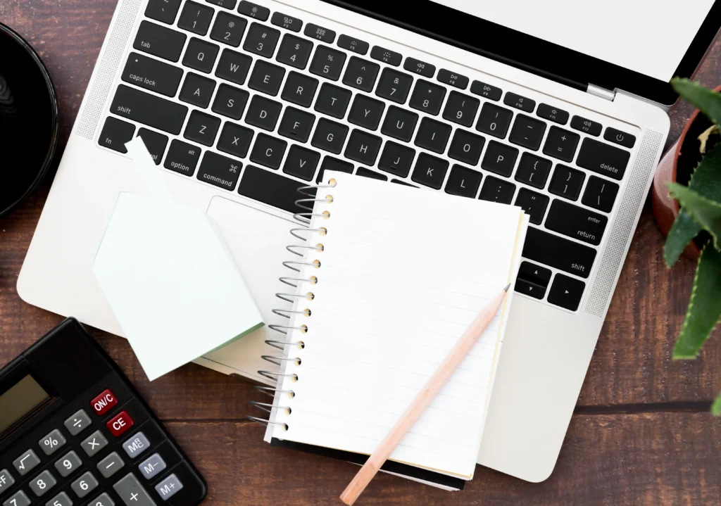 Blank Spiral Notebook With Pencil Open Laptop Wooden Table